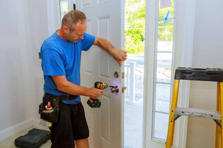 Contractor replacing a door