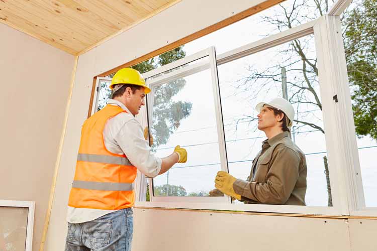 Contractors installing window